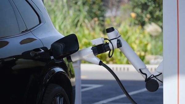 Automated robot charging an electric vehicle