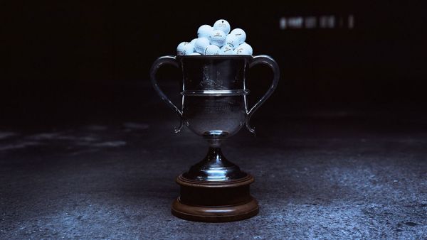 Golf trophy filled with golf balls