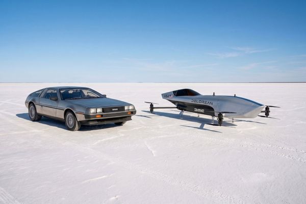 DeLorean car alongside a flying racing vehicle