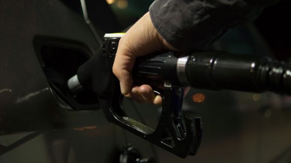 A vehicle being refuelled at a petrol pump