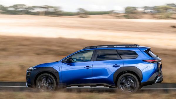 Blue Subaru SUV on the road